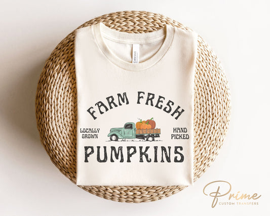 A DTF transfer with the words "Farm Fresh Pumpkins" with a picture of an old vintage truck with pumpkins in the back.