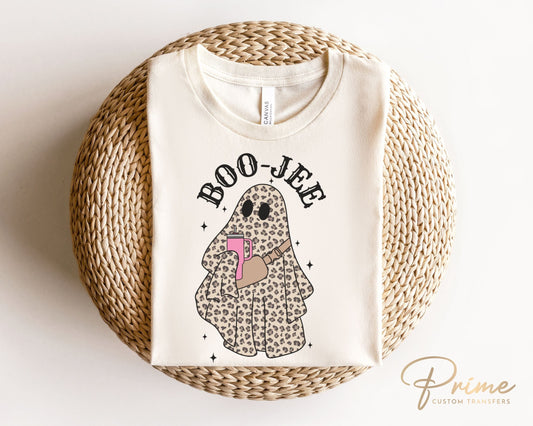 A cold peel direct to film transfer with a leopard patterned ghost holding a tumbler with the words boo-jee above it