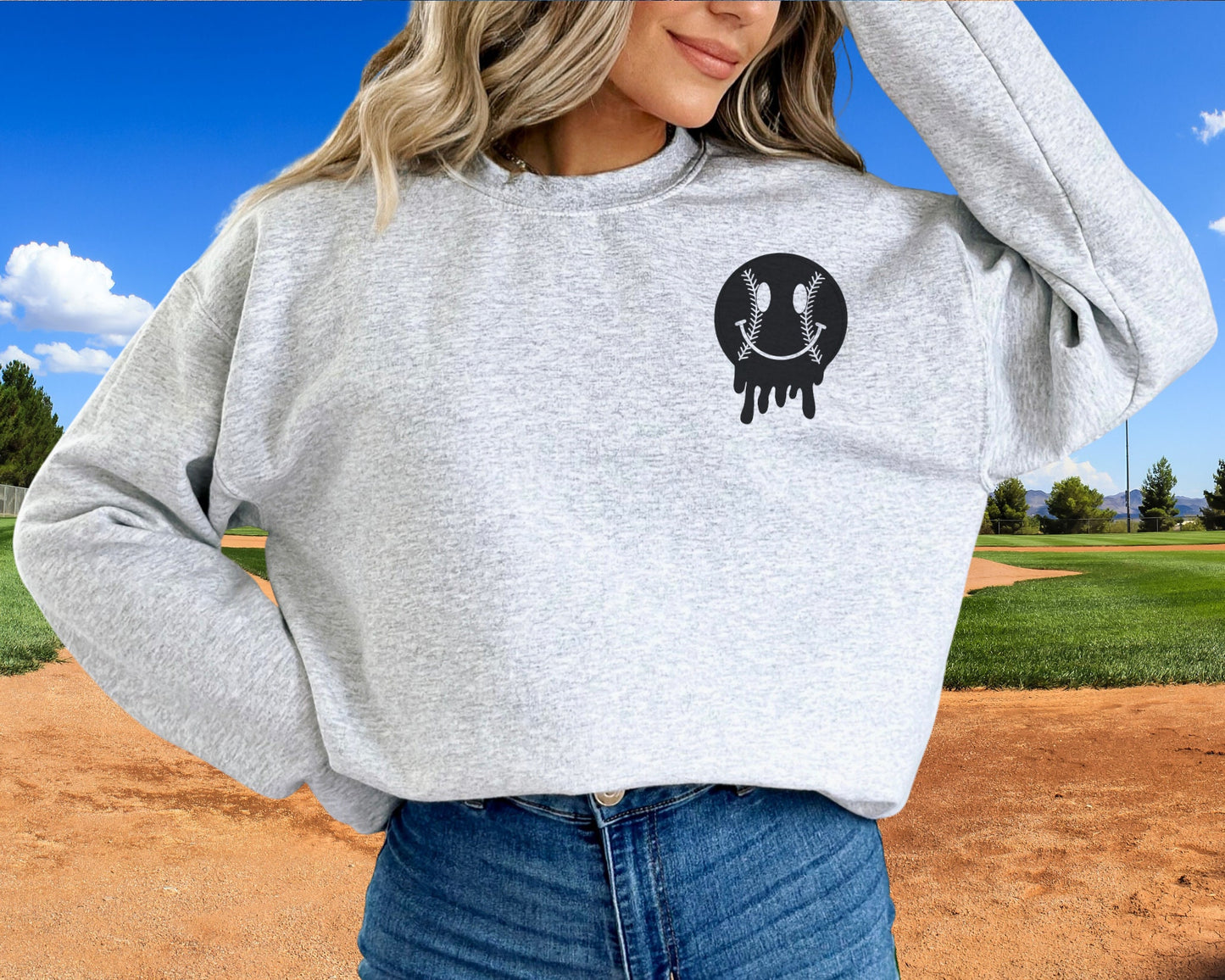 A direct to film transfer that says Somebody&#39;s Loud mouth Softball Mom. Back and front option. Front design is of baseball smiley face. The DTF transfer is a cold peel ready to press transfer.