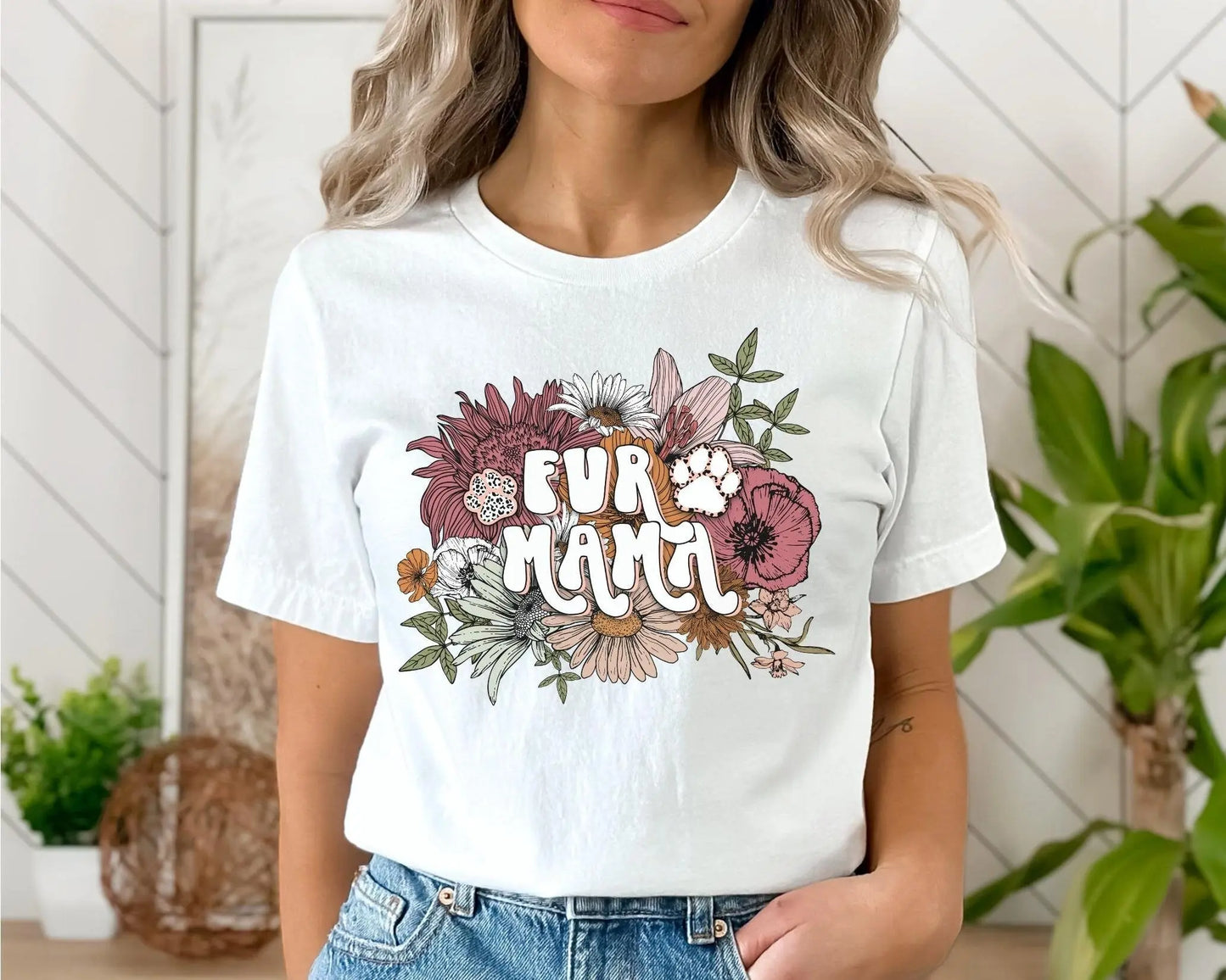 A direct to film transfer that has a floral background with the words Fur Mama overlayed on top. Fur Mama is written in a white colored retro font. The DTF transfer is a cold peel ready to press transfer.