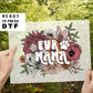 A direct to film transfer that has a floral background with the words Fur Mama overlayed on top. Fur Mama is written in a white colored retro font. The DTF transfer is a cold peel ready to press transfer.