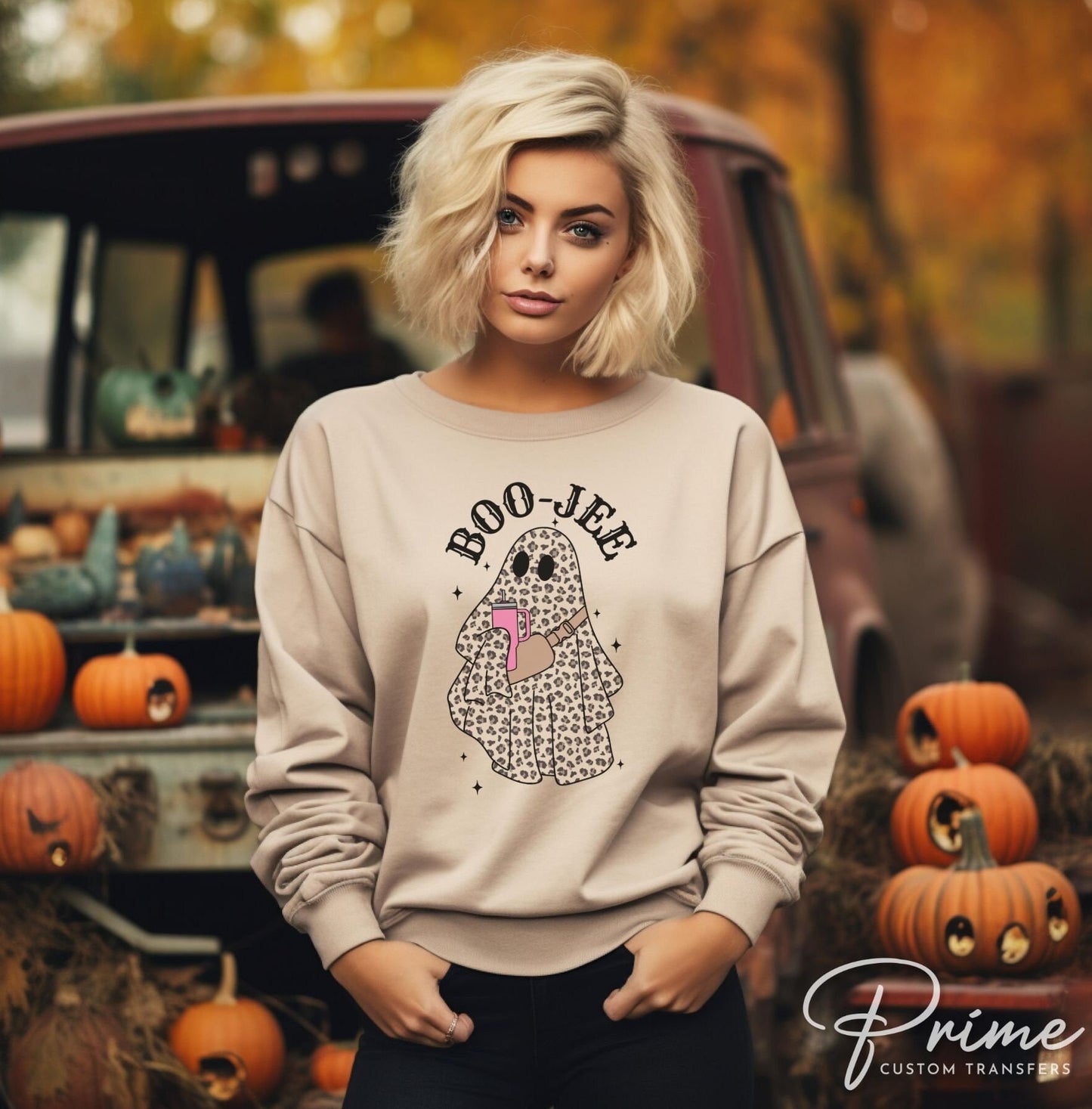 A cold peel direct to film transfer with a leopard patterned ghost holding a tumbler with the words boo-jee above it