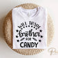 A cold peel halloween direct to film transfer with the saying "Will Trade Brother For Candy" in black or white writing.