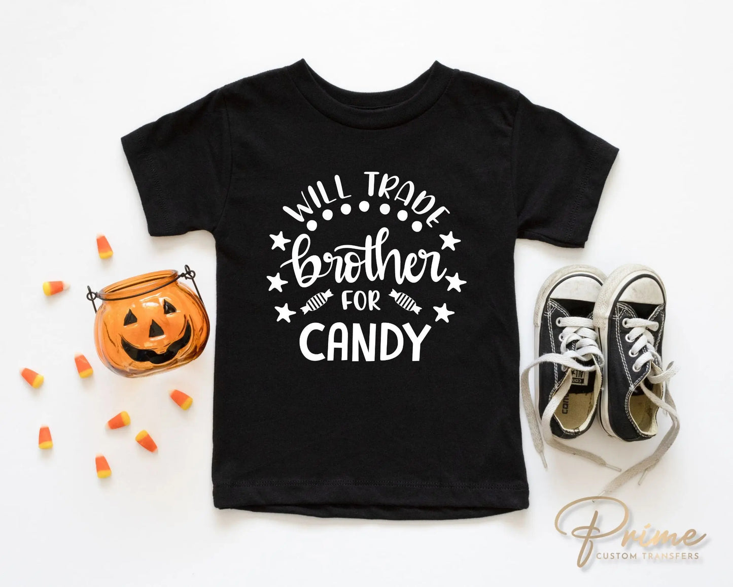 A cold peel halloween direct to film transfer with the saying "Will Trade Brother For Candy" in black or white writing.
