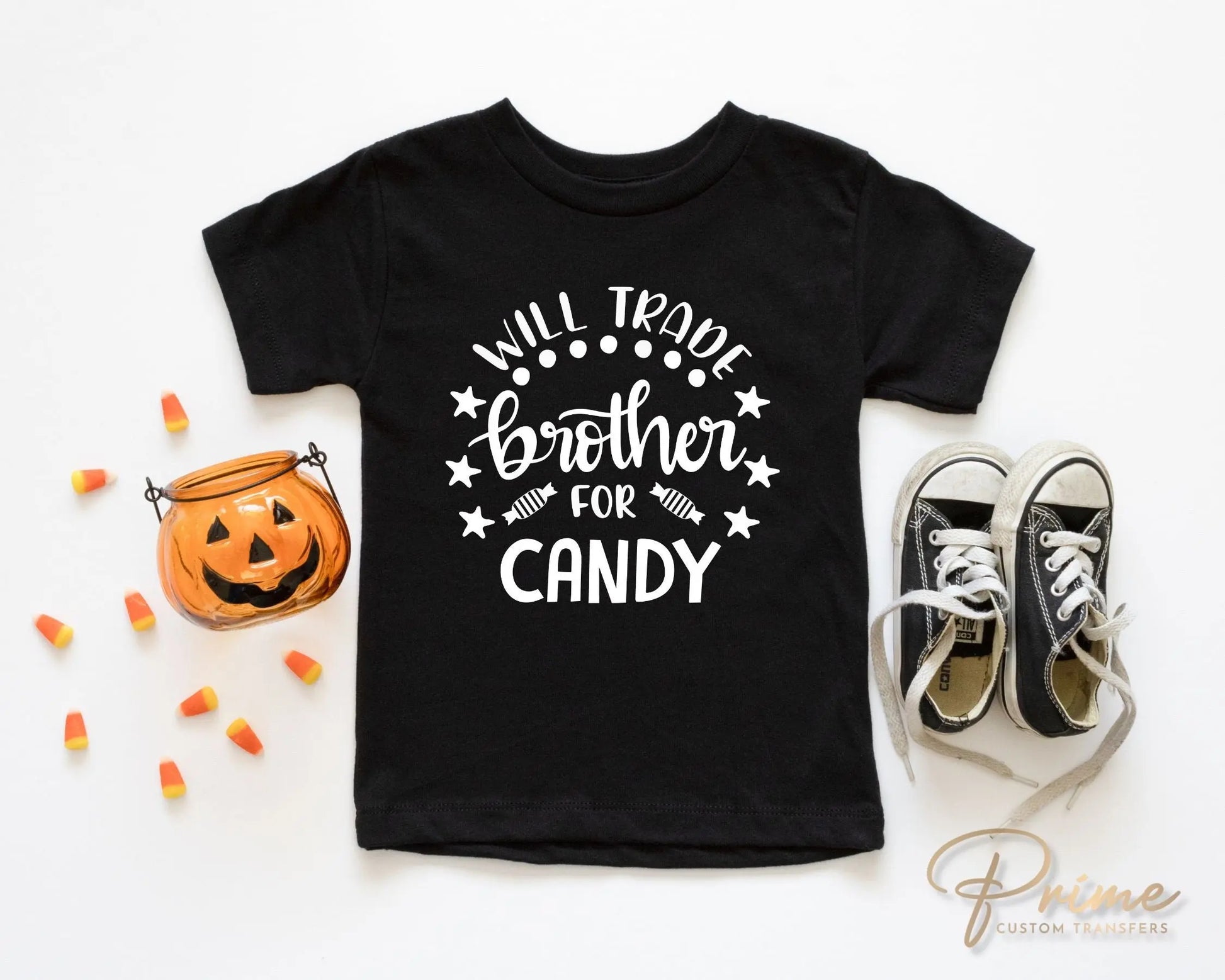 A cold peel halloween direct to film transfer with the saying "Will Trade Brother For Candy" in black or white writing.