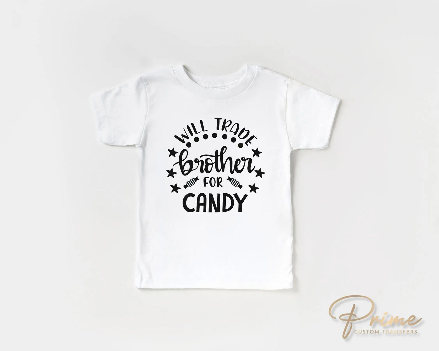 A cold peel halloween direct to film transfer with the saying "Will Trade Brother For Candy" in black or white writing.
