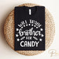 A cold peel halloween direct to film transfer with the saying "Will Trade Brother For Candy" in black or white writing.