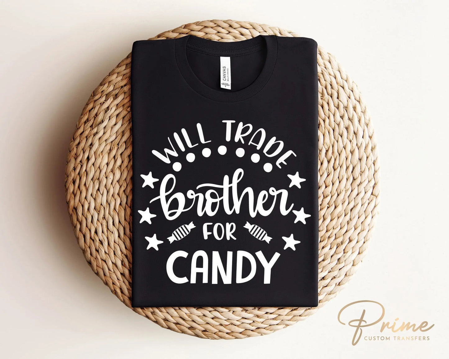 A cold peel halloween direct to film transfer with the saying "Will Trade Brother For Candy" in black or white writing.